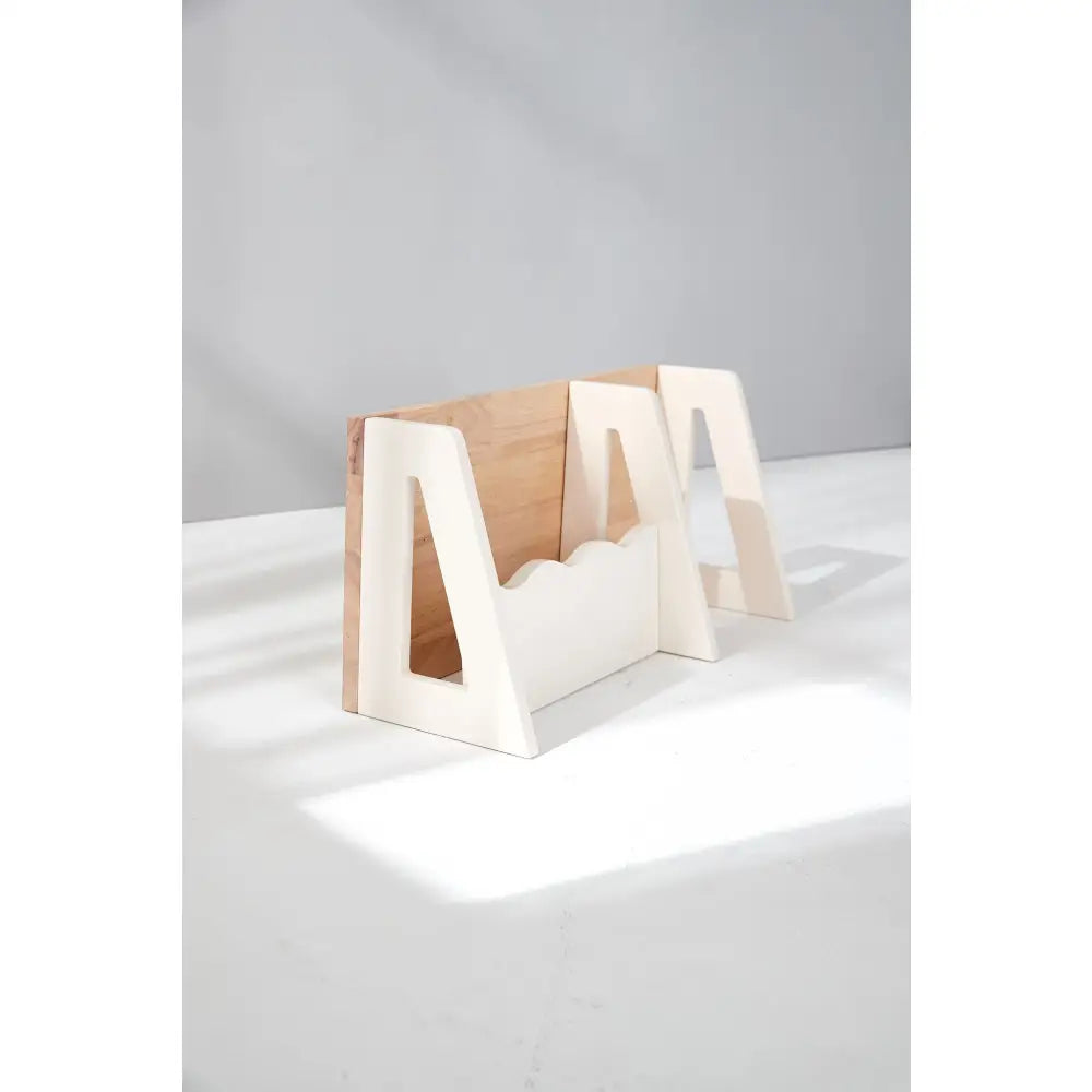 Wooden book holder or stand with a geometric, angular design.