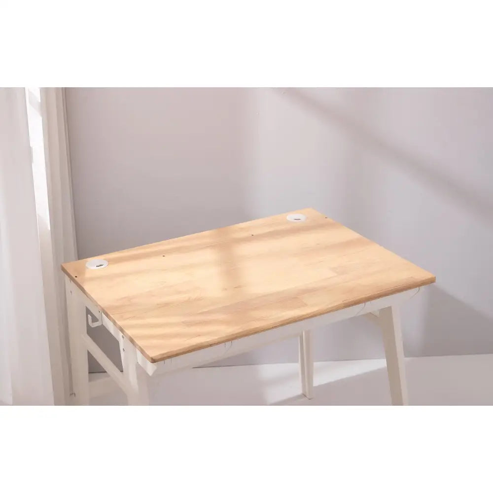 Simple wooden desk or table with light-colored top and white legs.