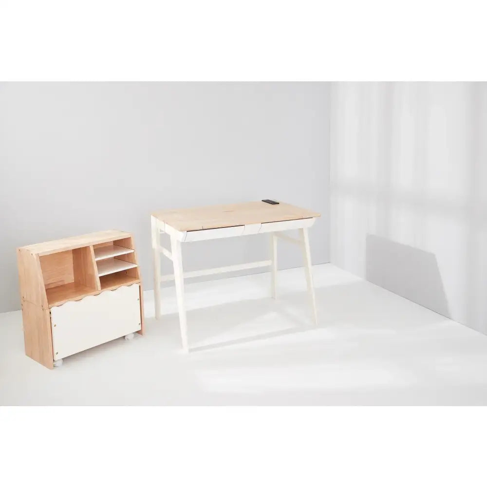 Simple wooden desk with white metal legs and a matching storage unit beside it.