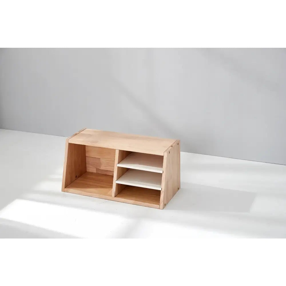 Wooden storage unit with open compartments and shelves.