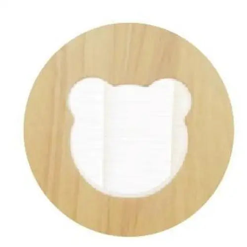 Circular wooden frame with a bear-shaped cutout in the center.