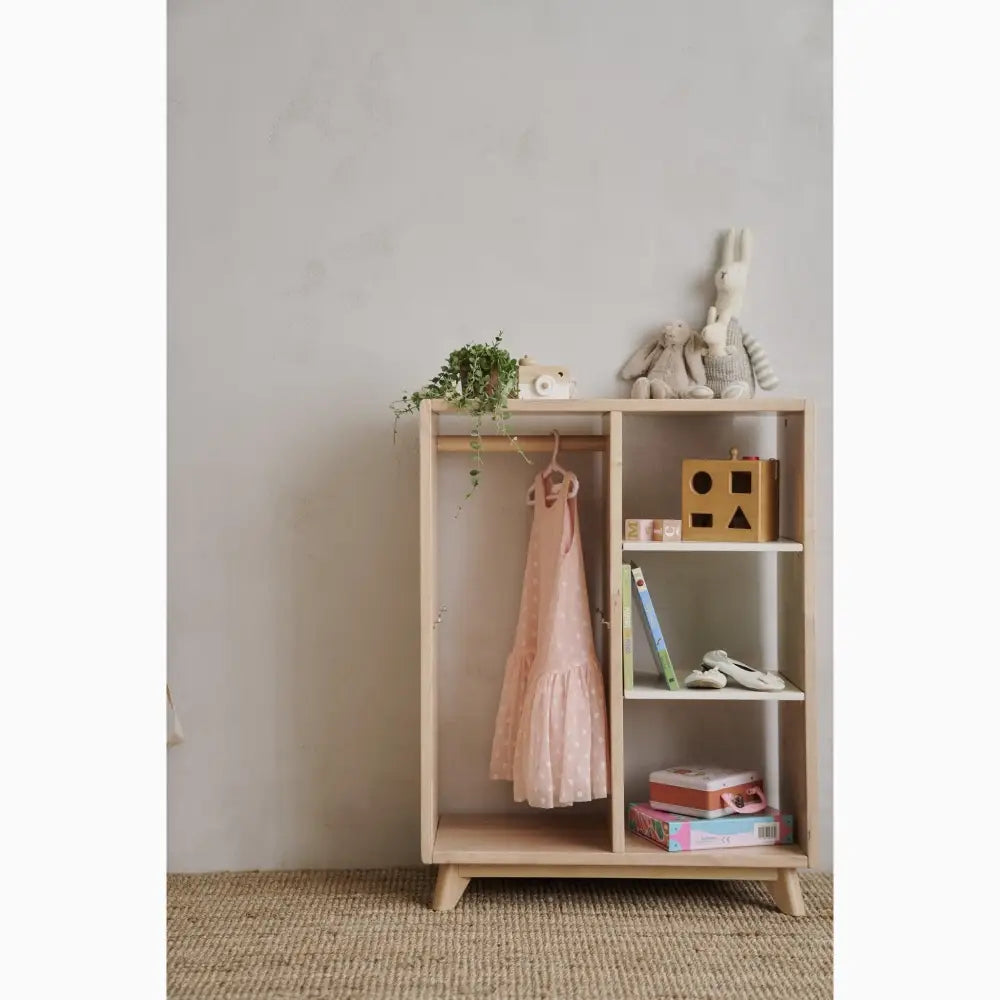 Wooden shelving unit with hanging space and compartments for storage.