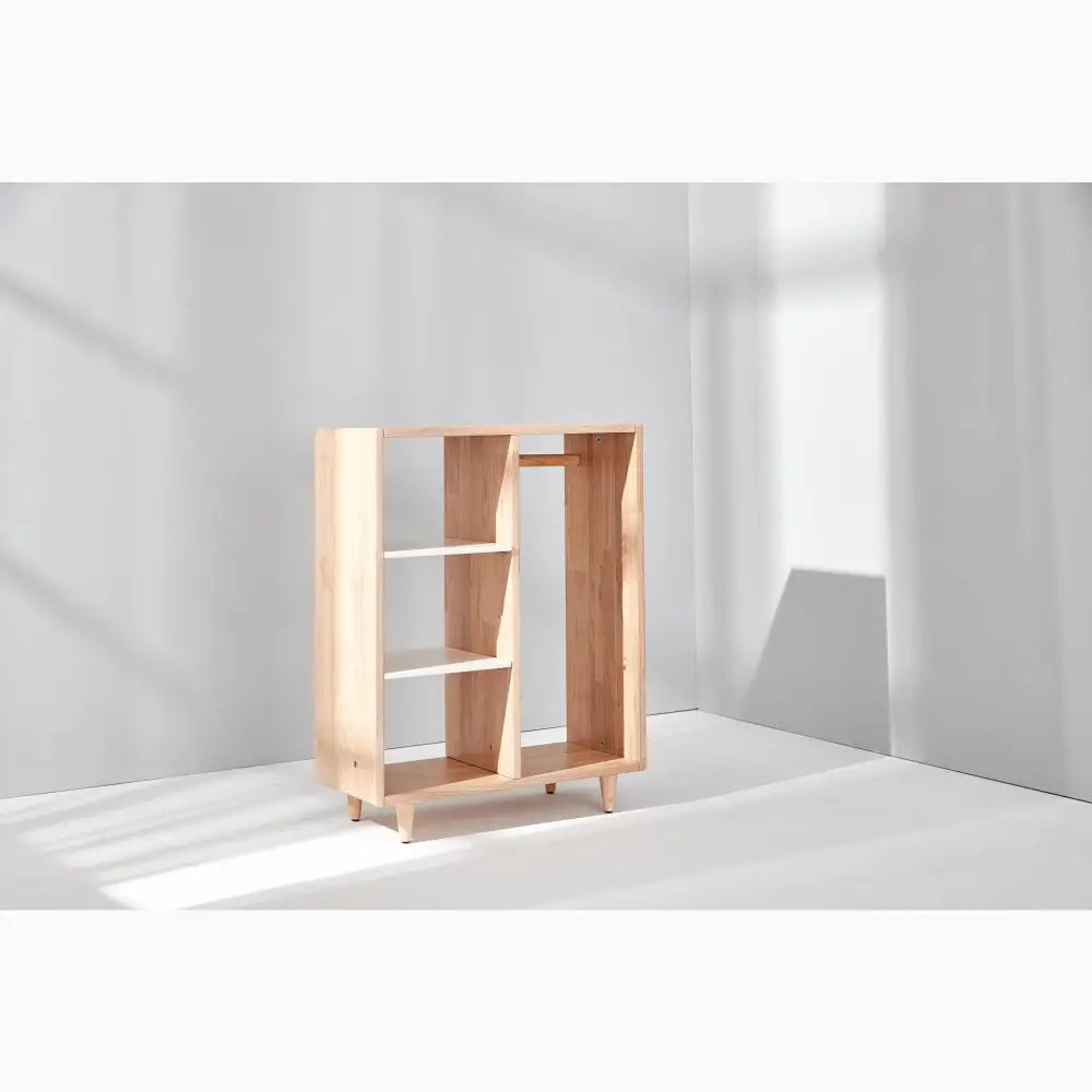 Modern wooden bookshelf with asymmetrical compartments.