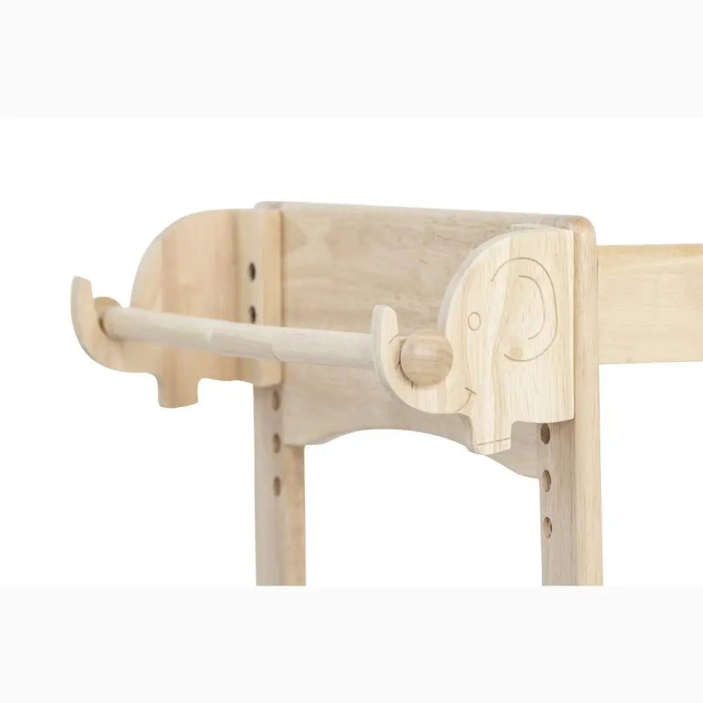 Wooden elephant-shaped towel or coat rack with curved trunk.