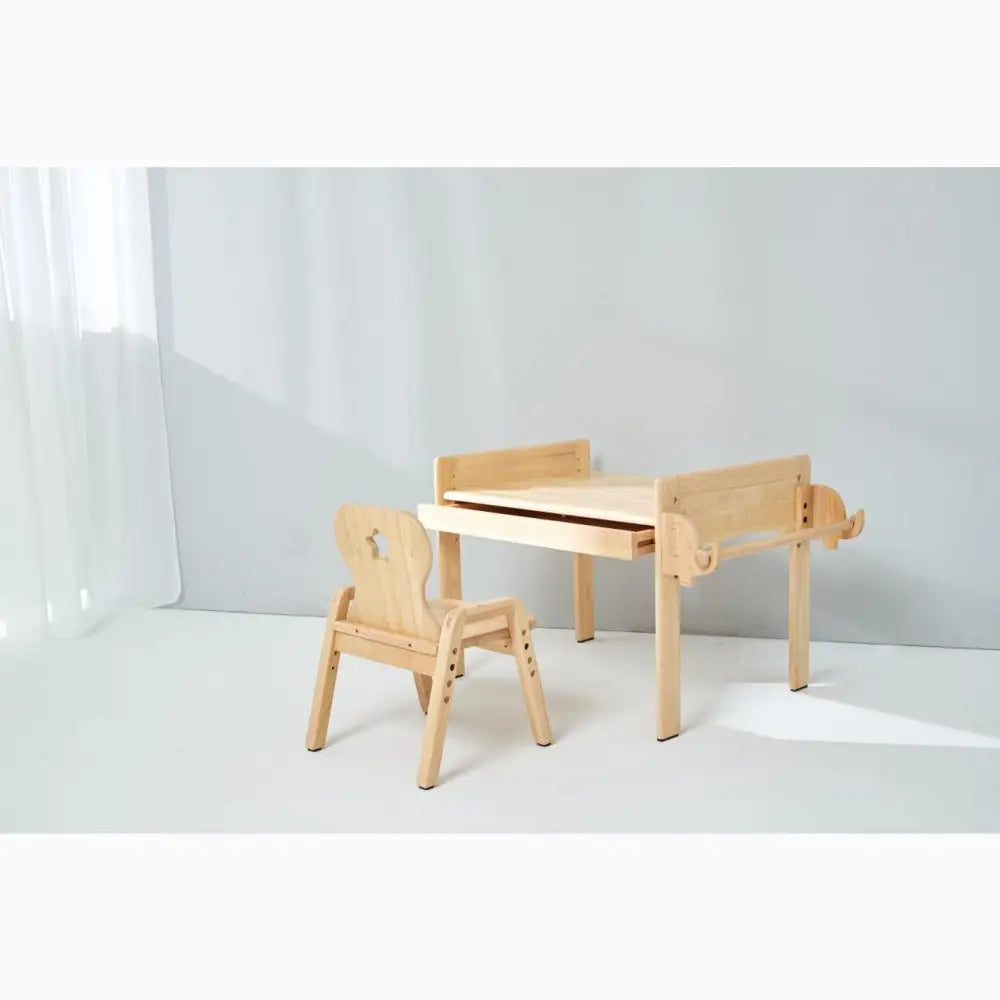 Wooden children’s desk and chair set with a minimalist design.