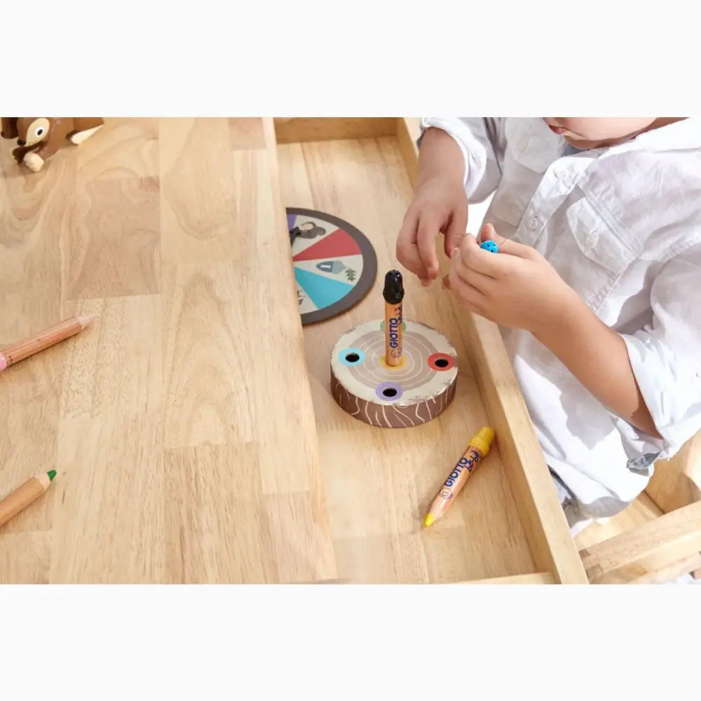 Wooden toy with colorful pegs for inserting into holes.