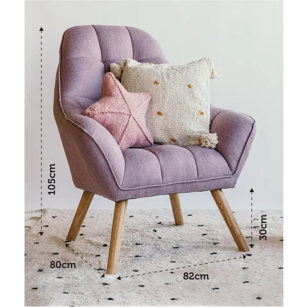 Lavender upholstered armchair with wooden legs and decorative cushions.