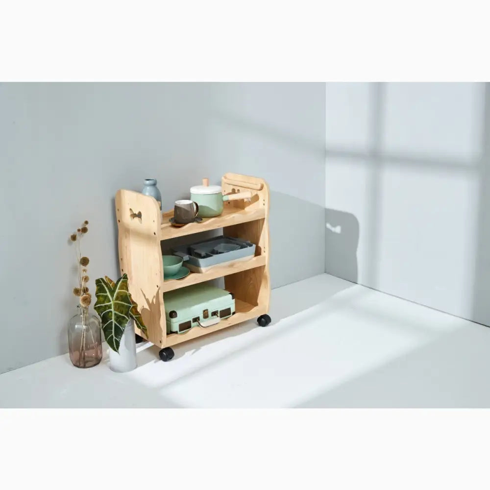 Wooden rolling cart with multiple shelves for storage.