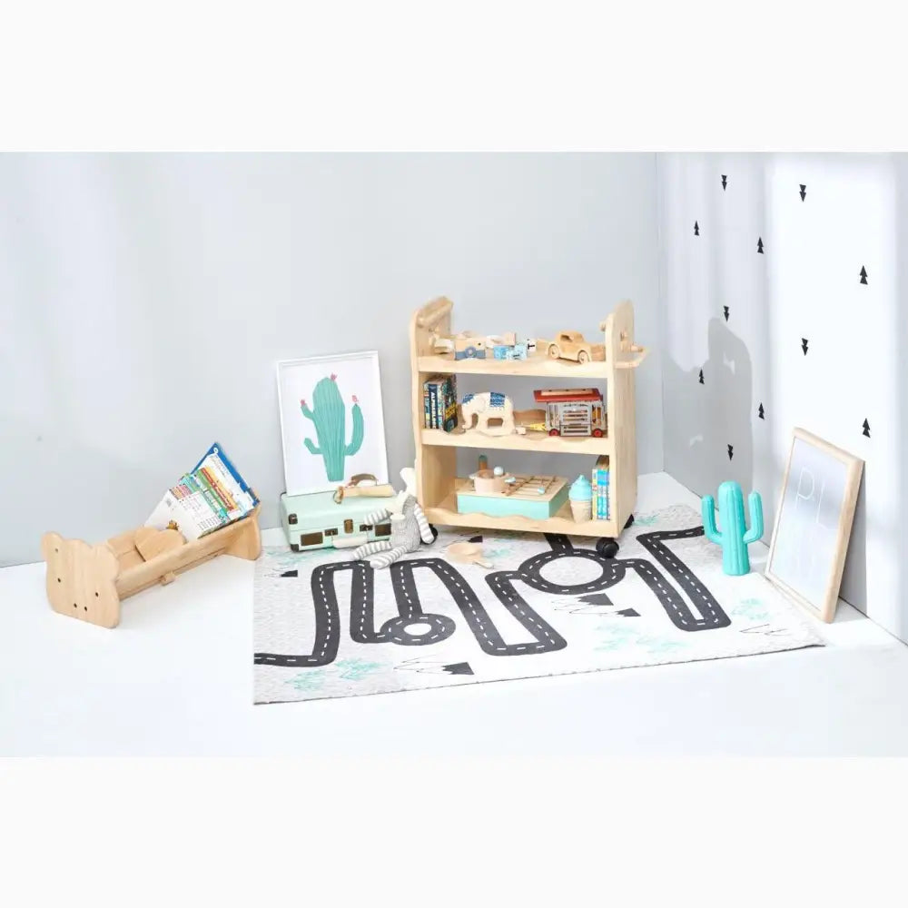 Wooden bookshelf or storage unit with toys and books on its shelves.