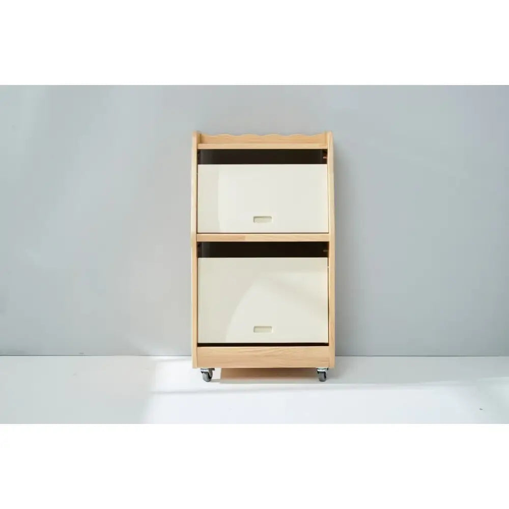 Wooden storage unit with two fabric drawers on wheels.