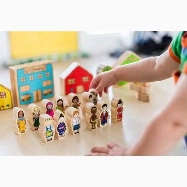 Wooden toy set featuring diverse miniature people figures and colorful house-shaped blocks.