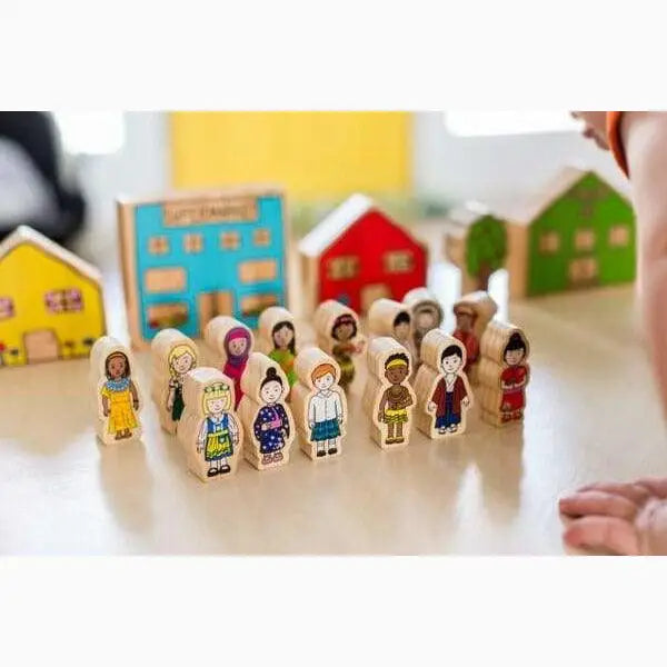 Wooden toy figures representing diverse children standing in a row.