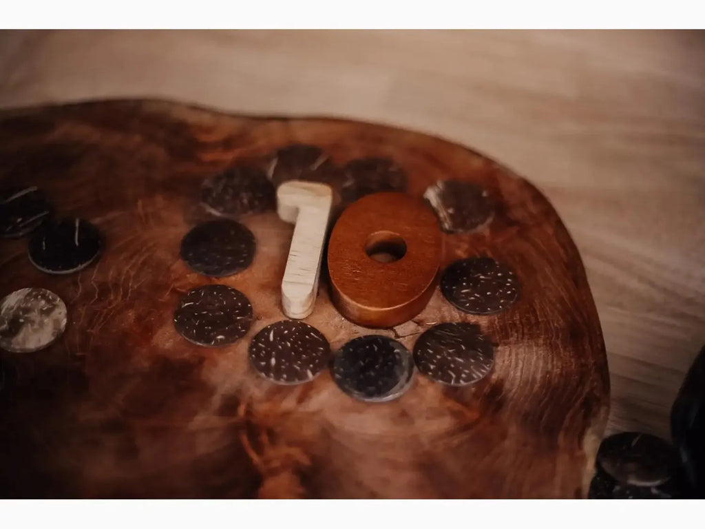 Chocolate cake decorated with cookies and a number 10 candle.