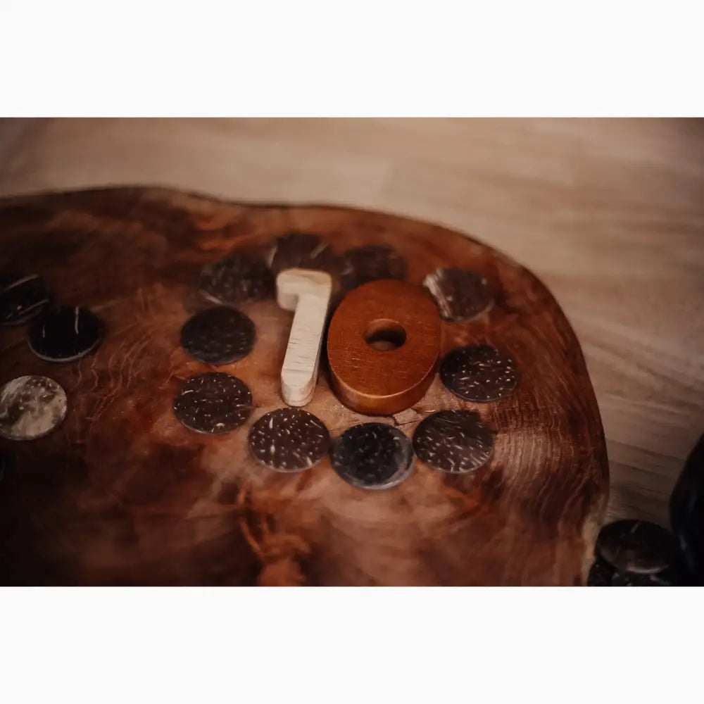 Chocolate cake decorated with cookies and a number 10 candle.