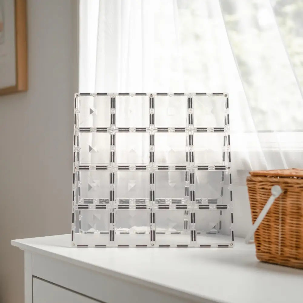 Clear acrylic organizer with multiple compartments arranged in a grid pattern.