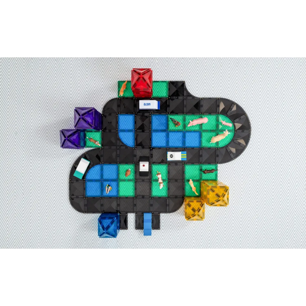 Colorful board game with a winding path made of various shaped tiles and pieces.