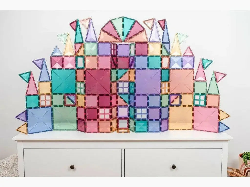 Colorful geometric building block set made of translucent plastic pieces in various shapes.