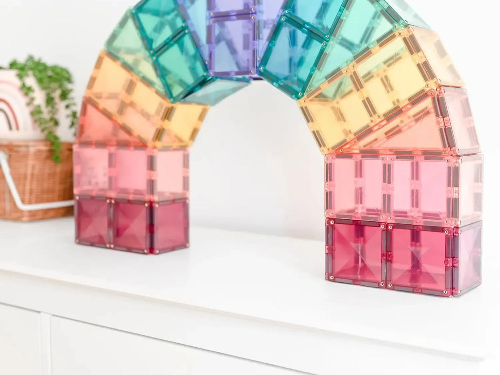 Rainbow-colored arch made of translucent magnetic building tiles.