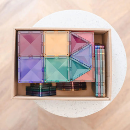 Colorful magnetic building tiles set in a storage box.