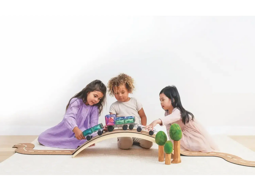Wooden toy train set with colorful cars on a curved track.