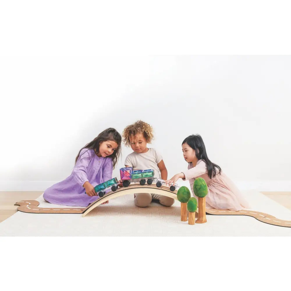 Wooden toy train set with colorful cars on a curved track.