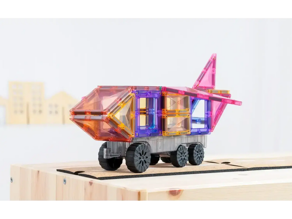 Colorful wooden toy wagon or cart with geometric shapes and wheels.