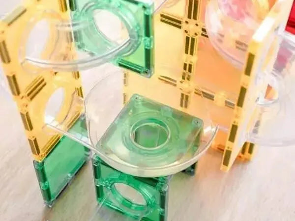 Colorful plastic construction toy with transparent pieces and geometric shapes.