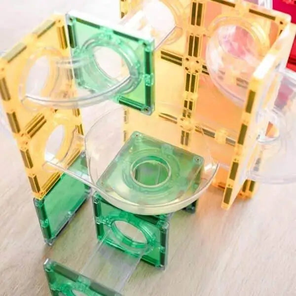 Colorful plastic construction toy with transparent pieces and geometric shapes.