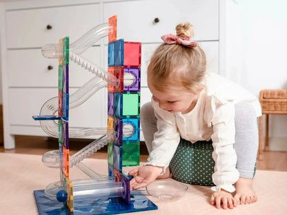 Colorful magnetic tile marble run toy with clear tubes and tracks.