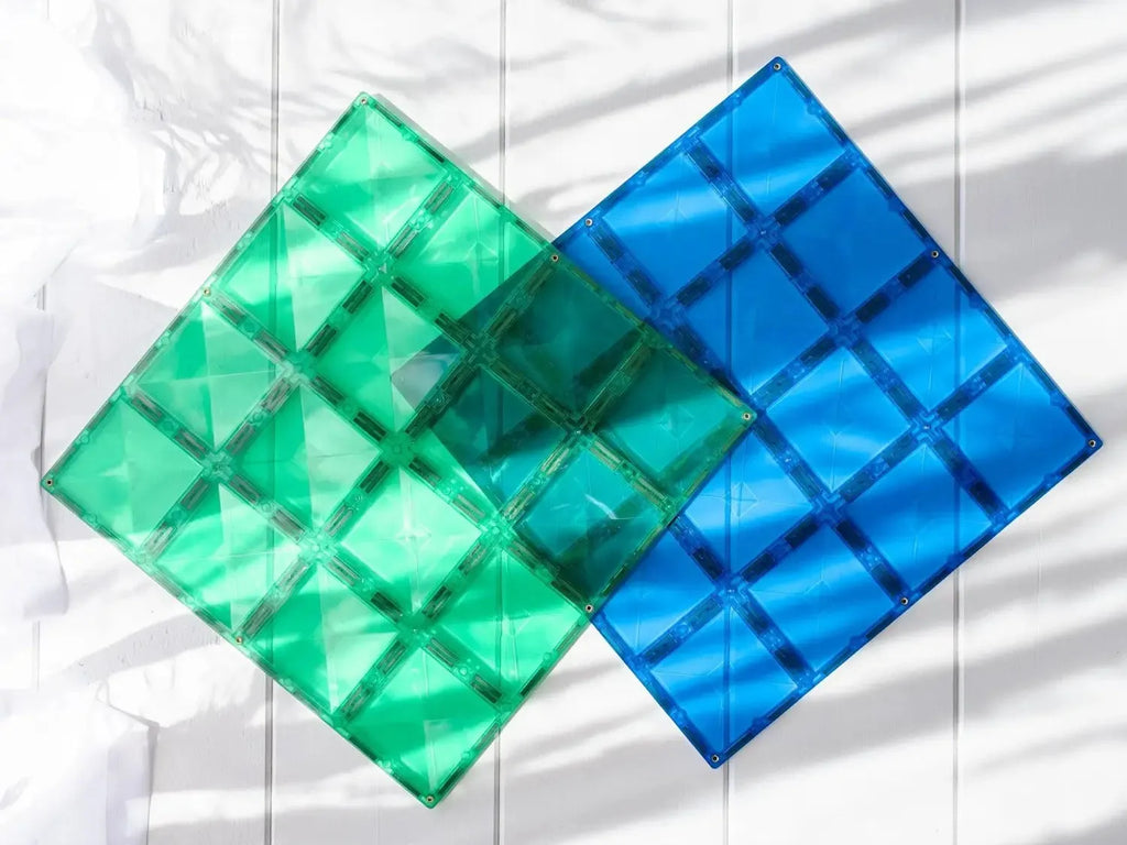 Two overlapping translucent geometric shapes in green and blue.