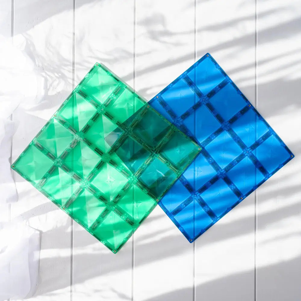 Two overlapping translucent geometric shapes in green and blue.