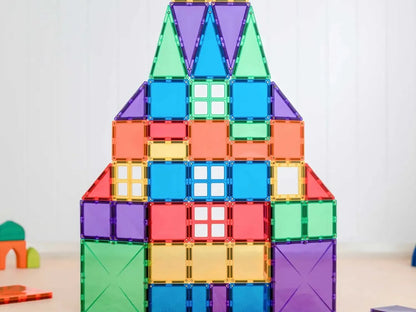 Colorful geometric structure built from magnetic tiles in the shape of a house or rocket.