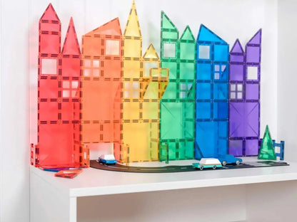 Colorful magnetic building blocks arranged to resemble a city skyline.