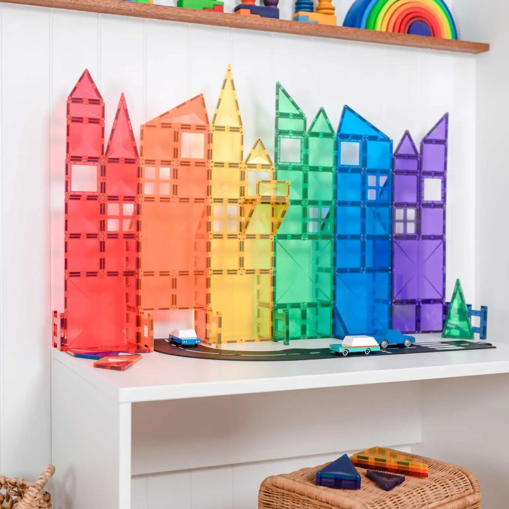 Colorful magnetic building blocks arranged to resemble a city skyline.