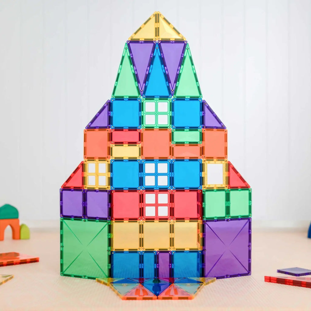 Colorful geometric structure built from magnetic tiles in the shape of a house or rocket.