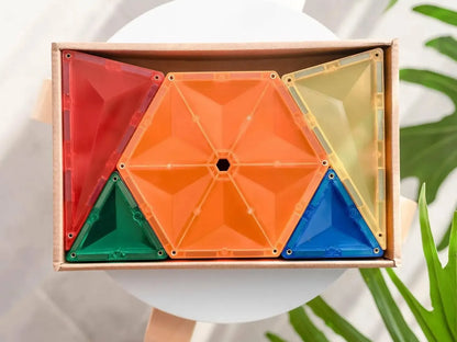 Colorful geometric puzzle or toy made of triangular and hexagonal shapes arranged in a wooden frame.