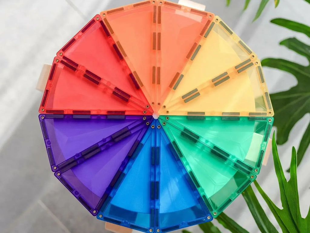 Colorful circular wheel made of triangular magnetic tiles in rainbow hues.