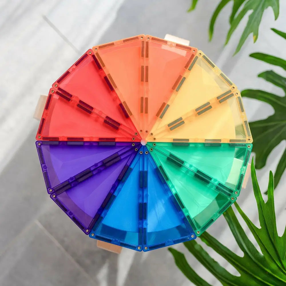 Colorful circular wheel made of triangular magnetic tiles in rainbow hues.