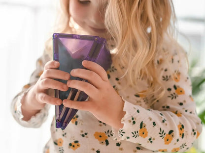 Purple tablet or e-reader device held by hands in a floral-patterned sleeve.