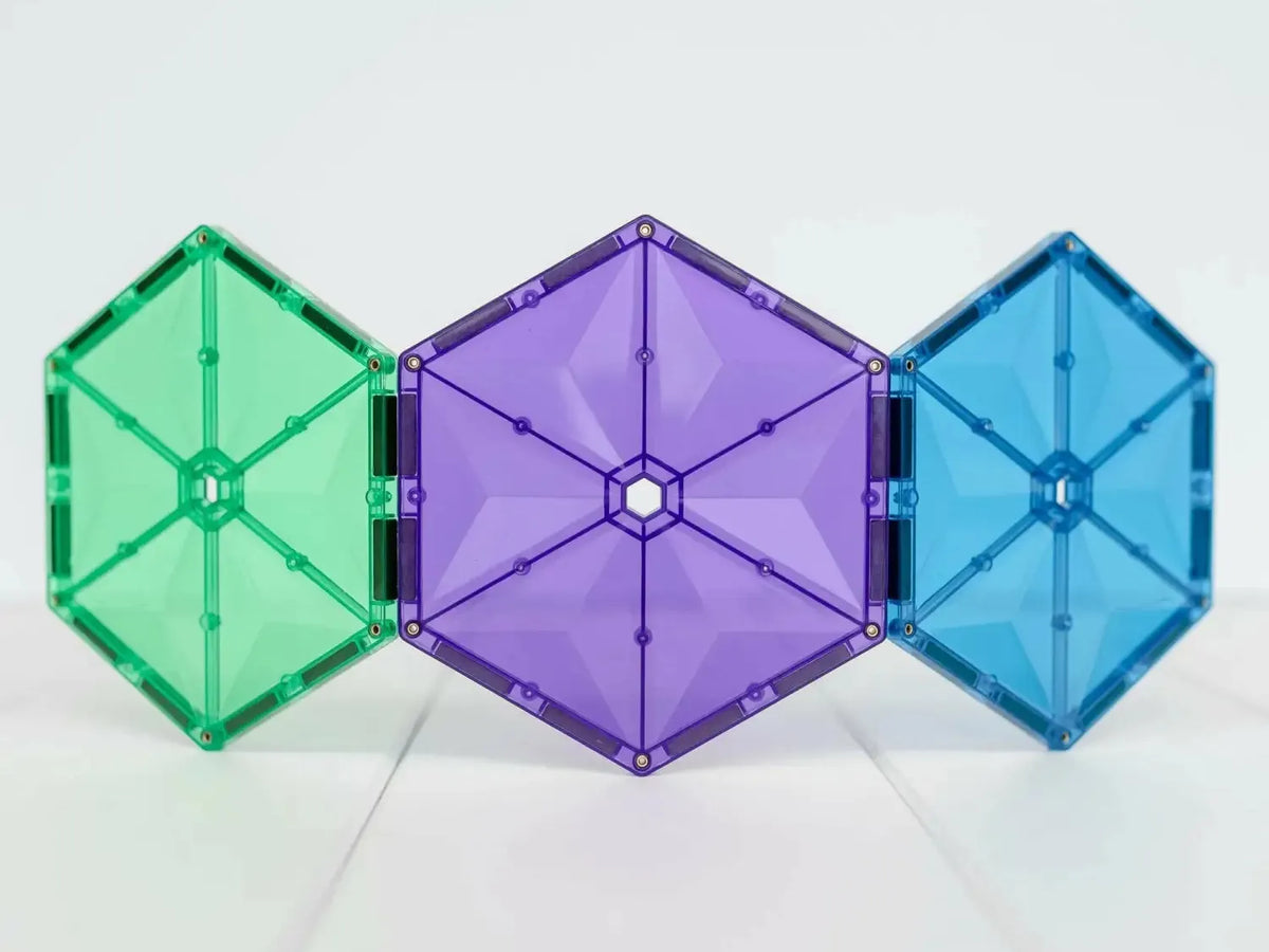 Three connected hexagonal magnetic tiles in green, purple, and blue colors.