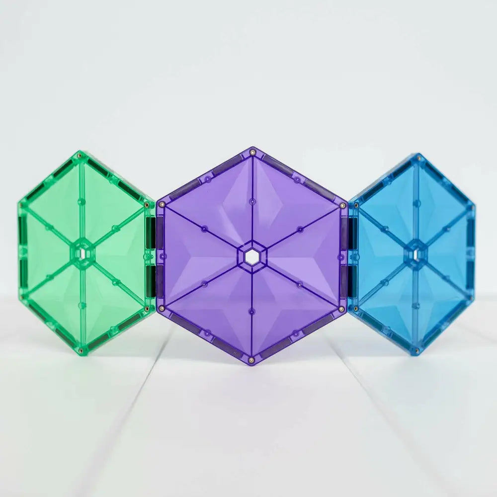 Three connected hexagonal magnetic tiles in green, purple, and blue colors.