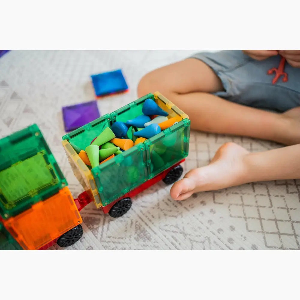 Colorful toy train with magnetic blocks in its compartments.