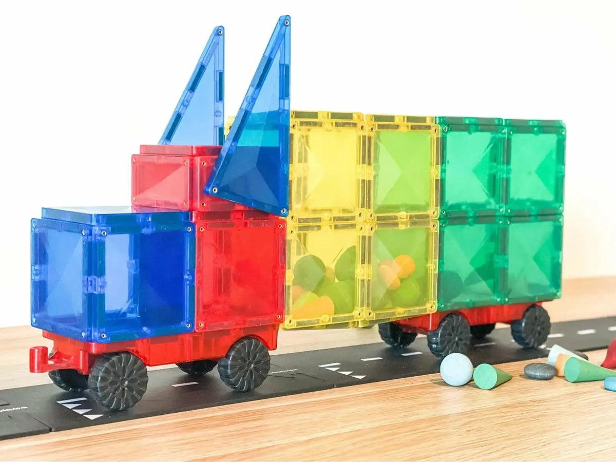 Colorful magnetic building block toy truck with trailer.