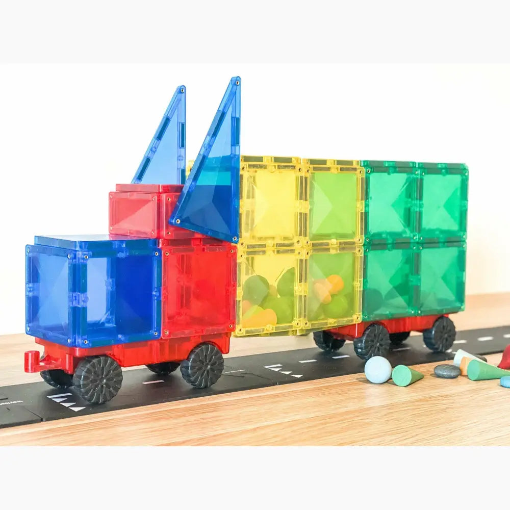 Colorful magnetic building block toy truck with trailer.