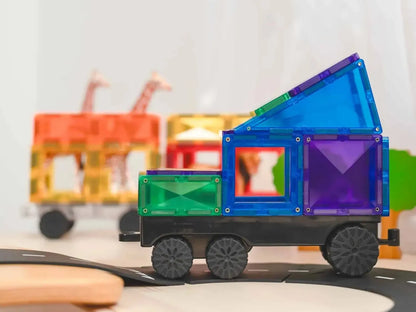 Colorful magnetic tile toy truck with geometric shapes forming the body and cargo area.