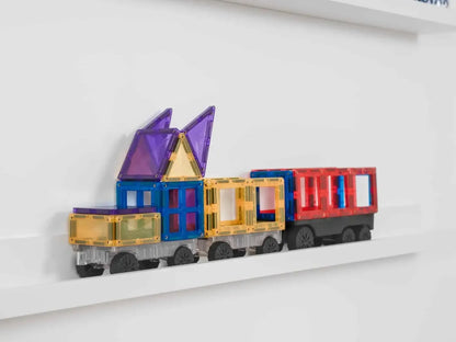 Colorful toy train made of magnetic building blocks on a shelf.
