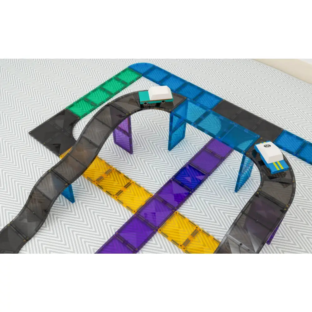 Colorful, interconnected track segments resembling a toy race track or building set.