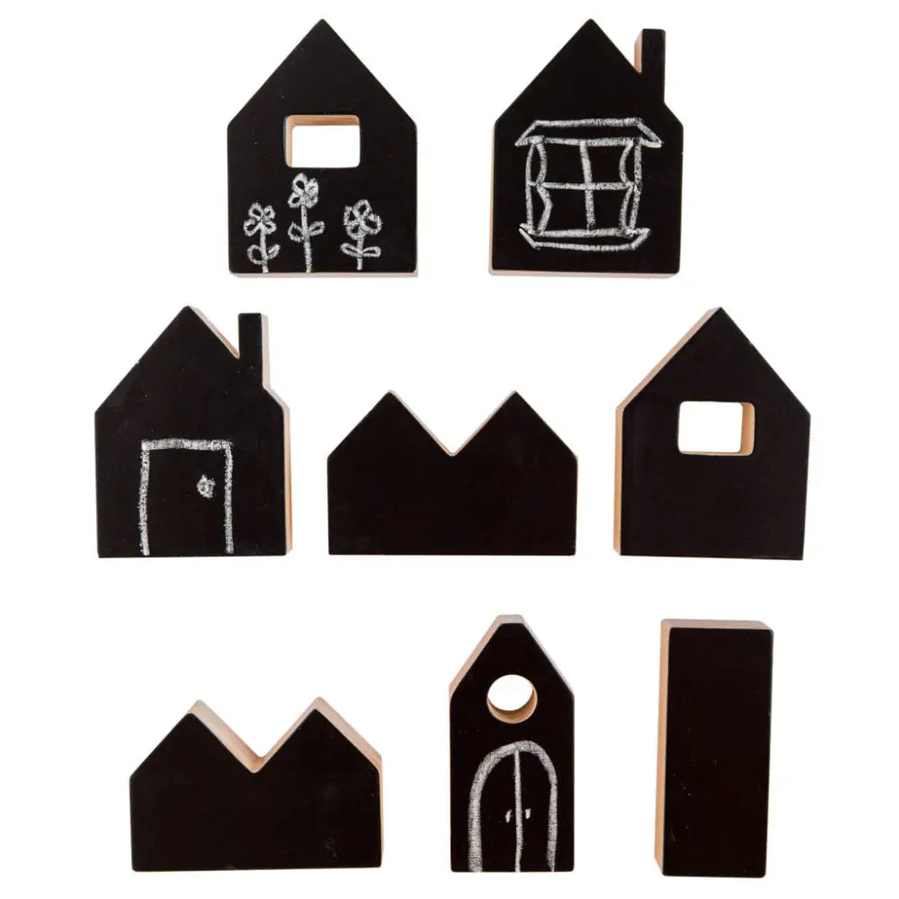 Set of black wooden house-shaped blocks with simple chalk-like drawings on them.