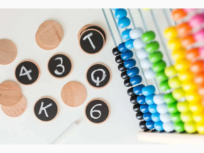 Colorful abacus with wooden discs displaying numbers.