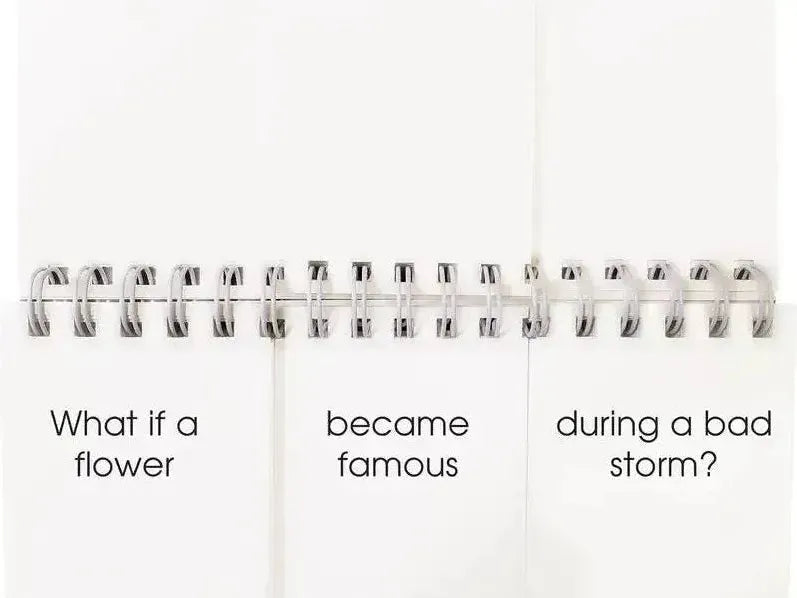 Spiral-bound notebook with a thought-provoking phrase written across three pages.